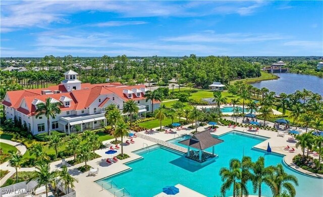 view of swimming pool with a water view