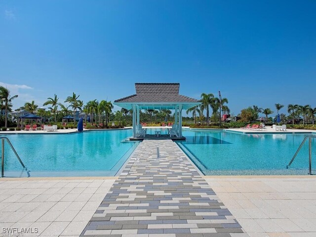 view of pool with a gazebo and a patio