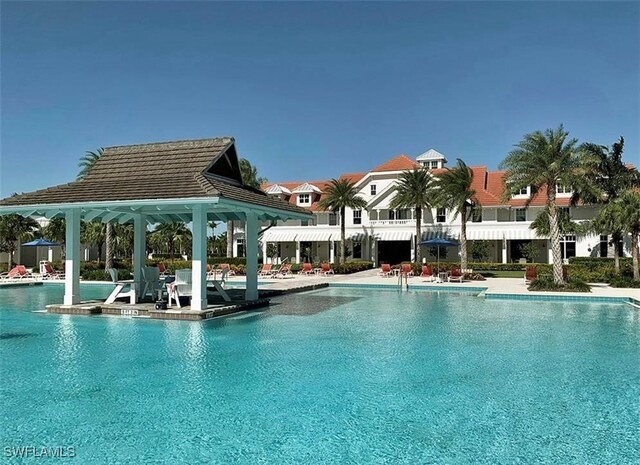 view of swimming pool featuring a patio area