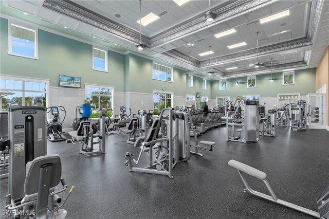 exercise room with a high ceiling