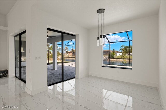 unfurnished dining area featuring ceiling fan