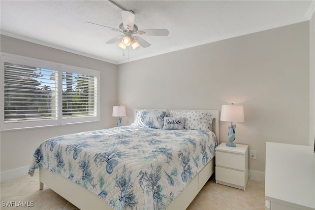 tiled bedroom with ceiling fan and crown molding