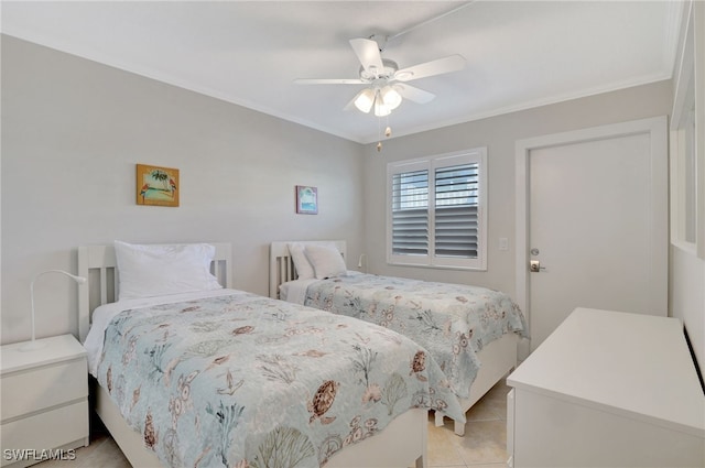 bedroom featuring ceiling fan, light tile patterned floors, and ornamental molding