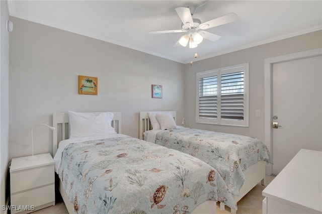 tiled bedroom featuring ceiling fan and ornamental molding