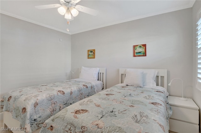 bedroom with ceiling fan and crown molding