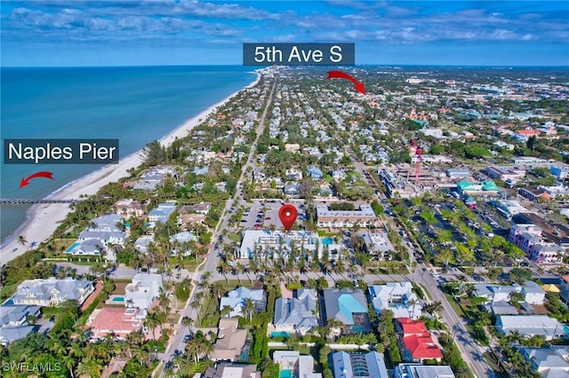 aerial view with a water view and a view of the beach