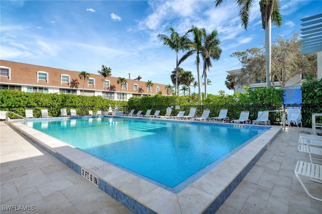 view of swimming pool with a patio