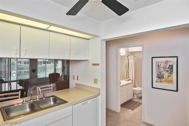 kitchen featuring ceiling fan, sink, white cabinets, and dishwasher