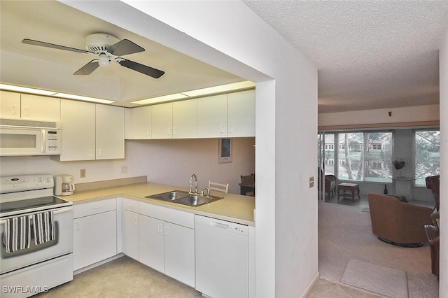 kitchen featuring white appliances, a textured ceiling, sink, white cabinets, and ceiling fan