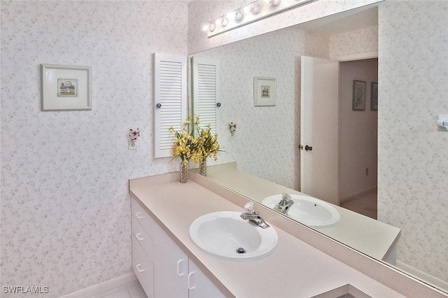 bathroom featuring tile patterned flooring and vanity