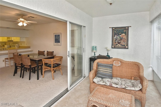 interior space featuring ceiling fan