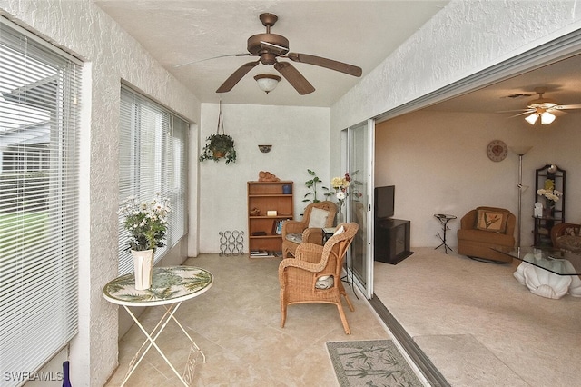 interior space featuring plenty of natural light and ceiling fan