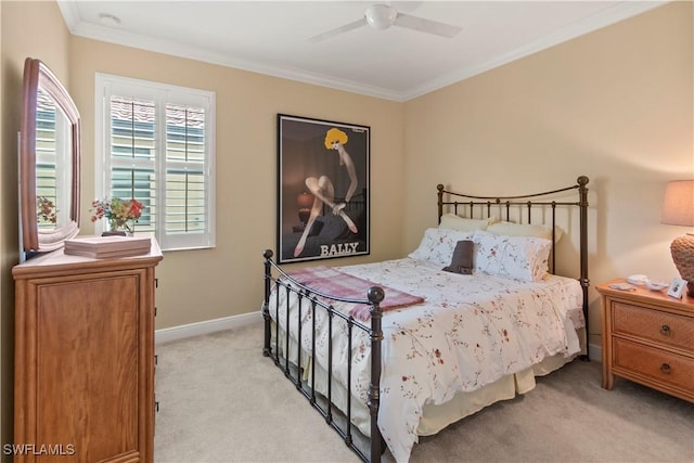 bedroom with ceiling fan, light colored carpet, and ornamental molding