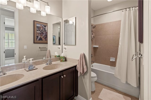 full bathroom with toilet, vanity, and shower / bath combo