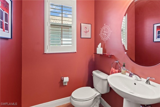 bathroom with toilet and sink