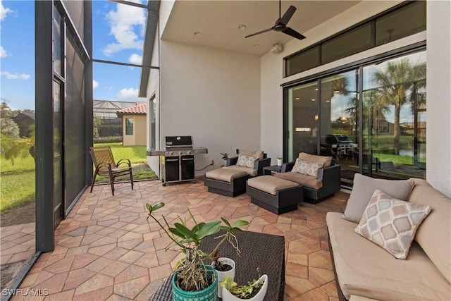 view of patio featuring ceiling fan, a lanai, a grill, and an outdoor hangout area