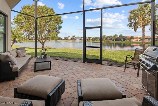 sunroom / solarium with a water view