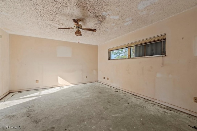 spare room featuring ceiling fan and a textured ceiling