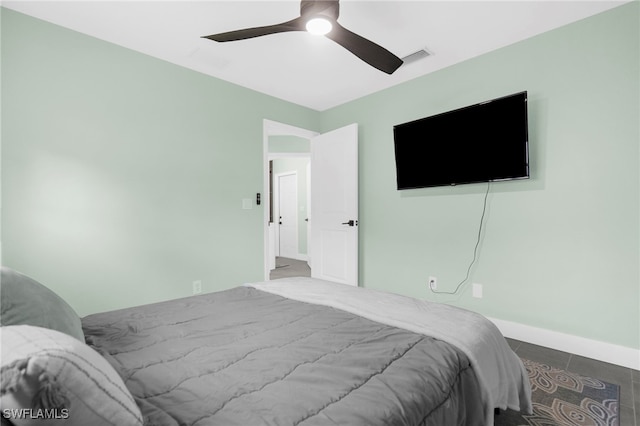 bedroom featuring tile patterned flooring and ceiling fan