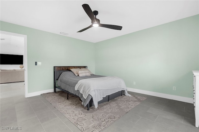 bedroom featuring tile patterned flooring and ceiling fan