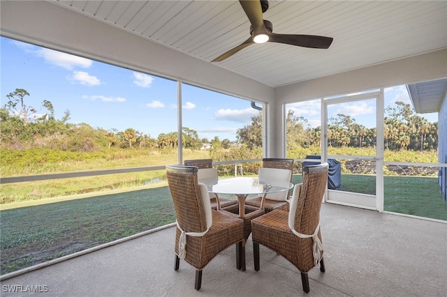 sunroom with plenty of natural light and ceiling fan