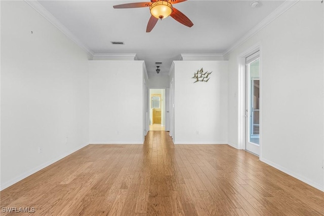 spare room with ceiling fan, ornamental molding, and light hardwood / wood-style flooring