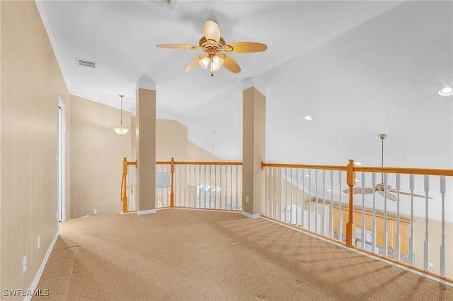 empty room featuring ceiling fan, carpet, and lofted ceiling