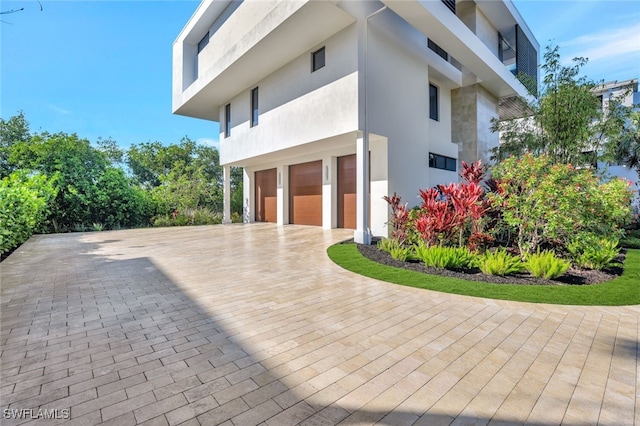 view of side of home with a garage