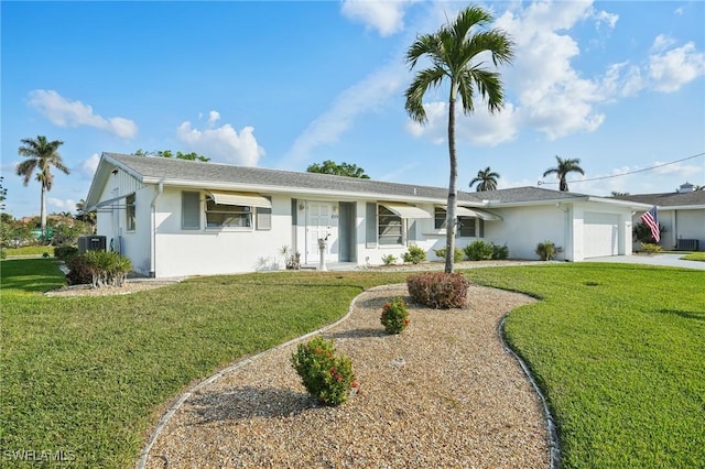 ranch-style home featuring a front yard and a garage