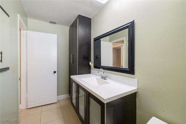 bathroom with vanity and tile patterned floors