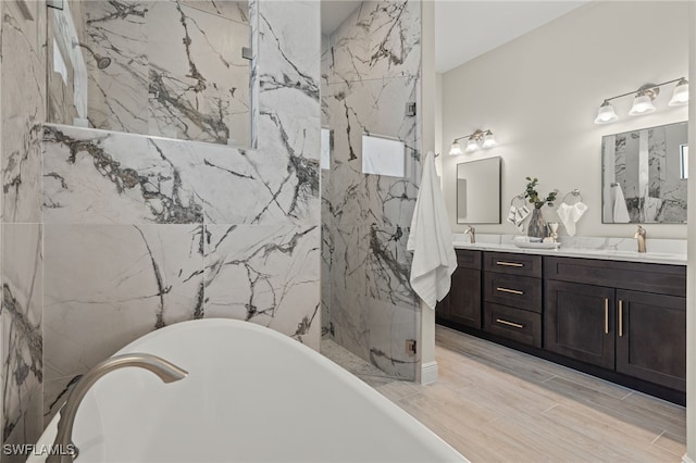 bathroom featuring vanity and separate shower and tub