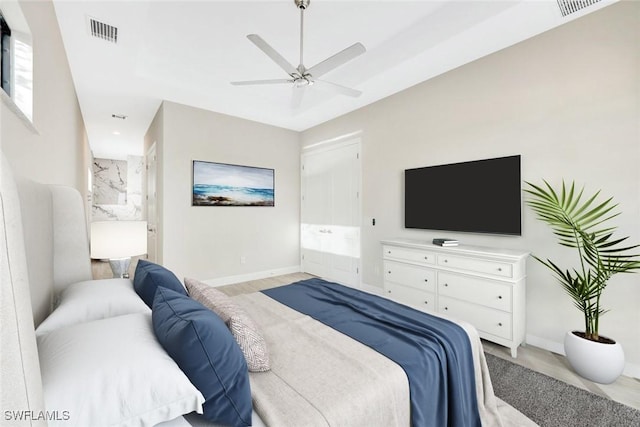 bedroom with connected bathroom and ceiling fan