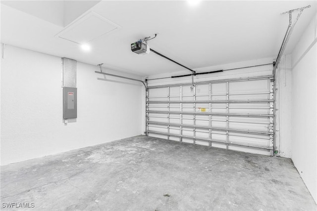 garage featuring electric panel and a garage door opener