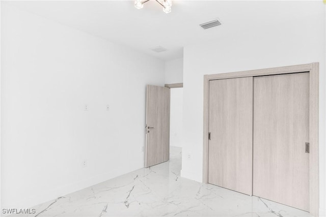 unfurnished bedroom with a closet