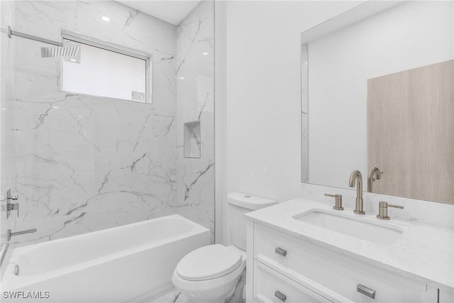 full bathroom featuring tiled shower / bath combo, toilet, and vanity