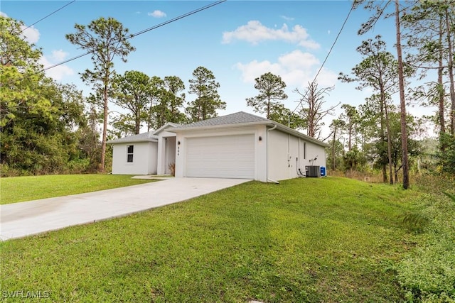 single story home with a front yard, central AC, and a garage