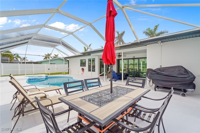 view of swimming pool featuring ceiling fan, a lanai, a grill, a patio area, and an in ground hot tub