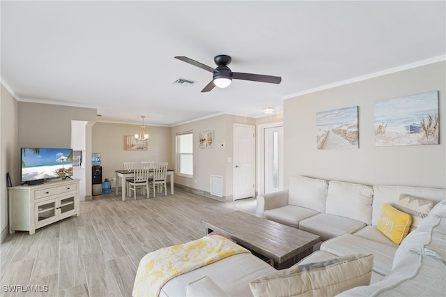 living room with ceiling fan with notable chandelier, light hardwood / wood-style floors, and ornamental molding