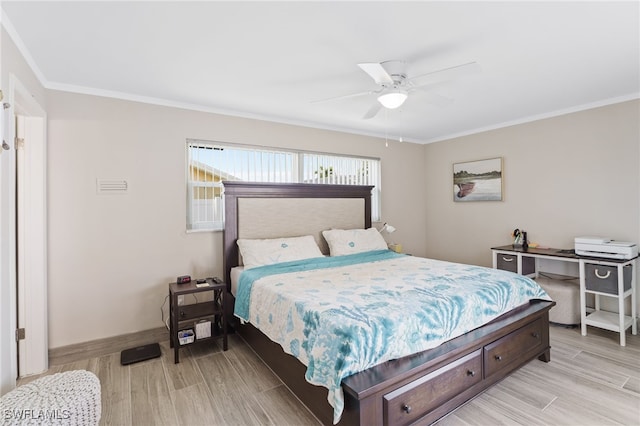 bedroom with light hardwood / wood-style floors, ceiling fan, and crown molding