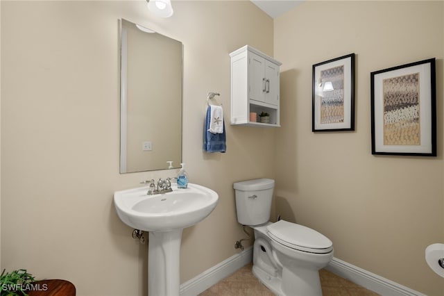 bathroom featuring tile patterned floors and toilet