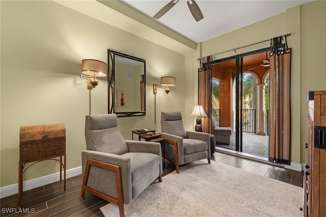 living area featuring ceiling fan