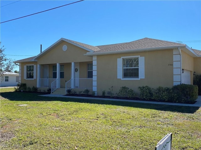 single story home with a porch, a garage, and a front yard