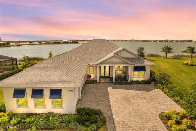 view of front of house featuring a water view