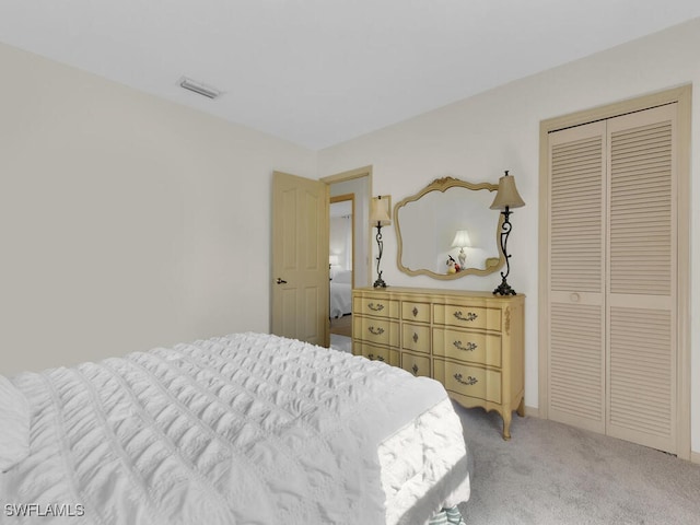 bedroom with a closet and carpet