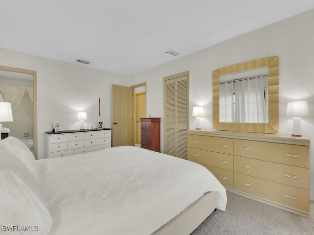 carpeted bedroom featuring a closet