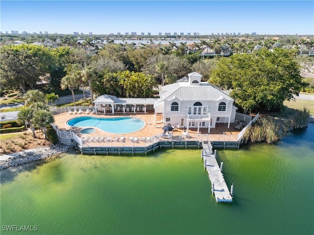 birds eye view of property with a water view