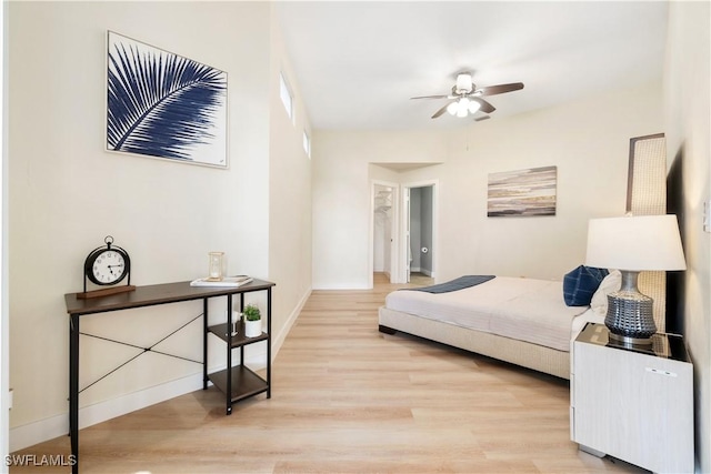 bedroom with light wood-type flooring and ceiling fan