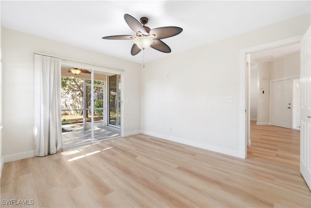 spare room with ceiling fan and light wood-type flooring