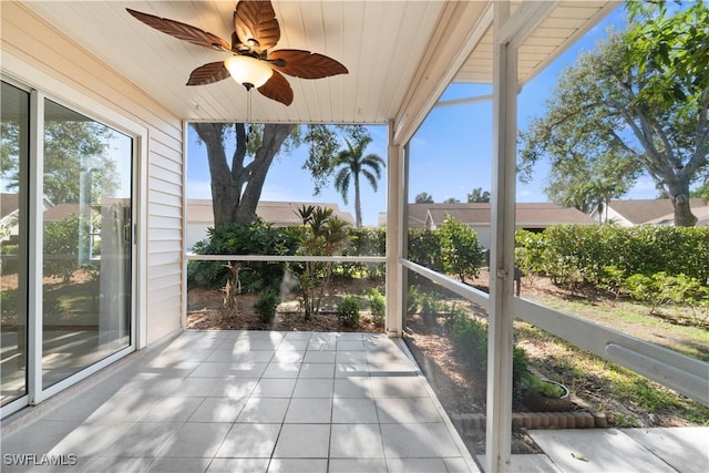 unfurnished sunroom with a healthy amount of sunlight and wood ceiling