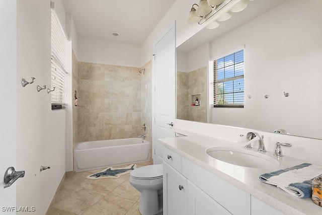 full bathroom with tile patterned floors, tiled shower / bath combo, toilet, and vanity